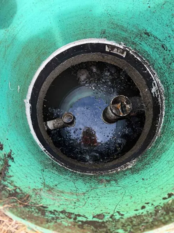Looking down into the tank at the inlet and outlet baffles.