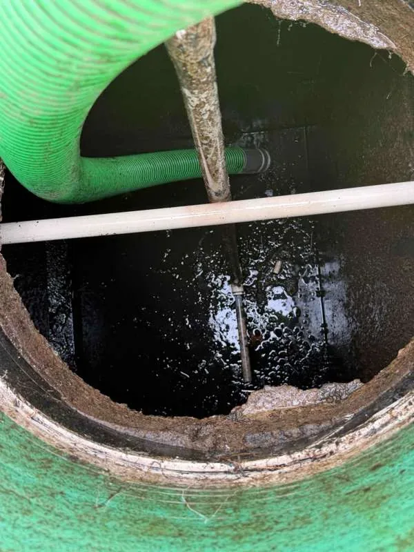 The suction hose down in the tank during pumping.