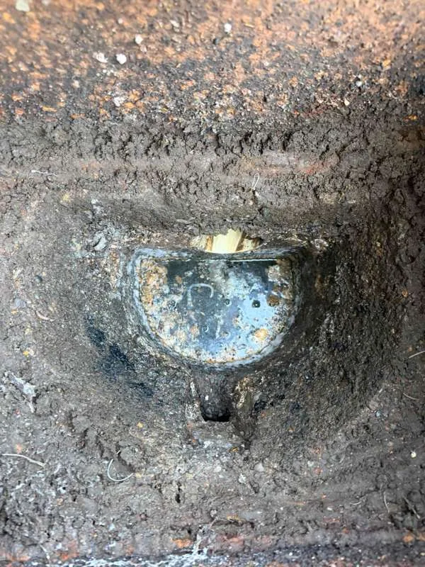 A baffle inside the tank, seen from the access opening above.