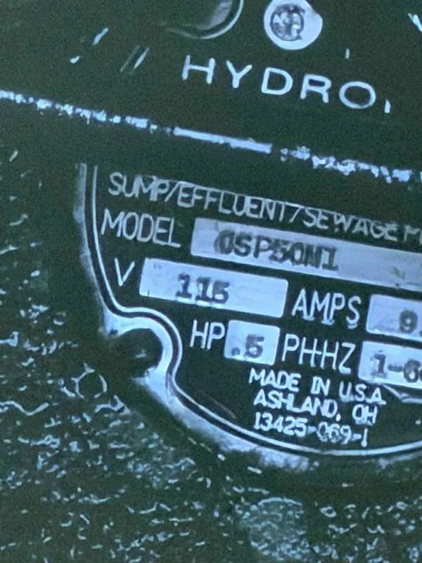 The existing pump's nameplate, a half-horsepower 115-volt effluent pump.