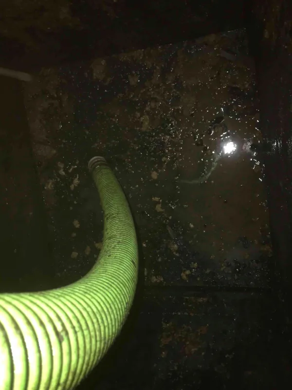 The suction hose working in the tank.