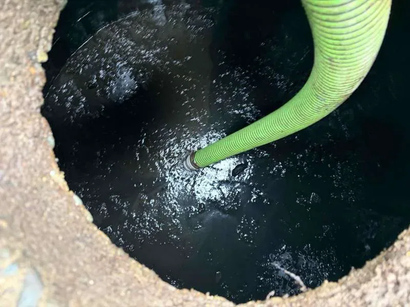 The suction hose working in the tank.