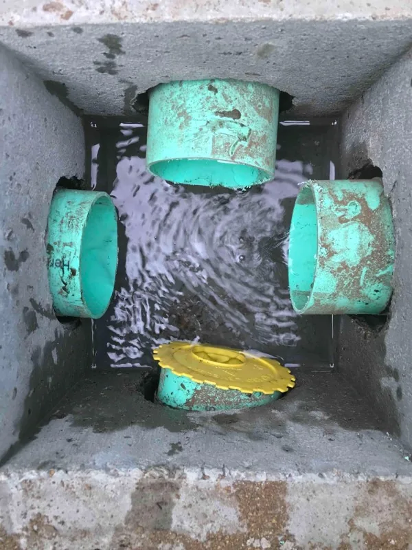 Inside the distribution box after the work, with a yellow leveler fitted into one of the outlets.